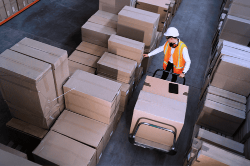 staff working across busy distribution site avoiding logistics security risks